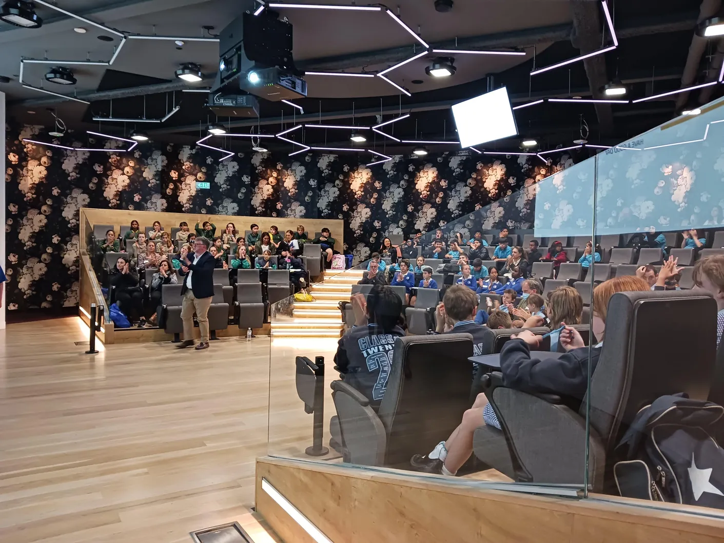 Young presenters and educators taking part in a Kids' Conference